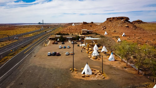 High angle view of vehicles on road against sky