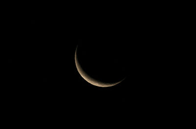 Low angle view of moon against sky at night