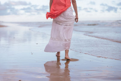 Woman standing on beach