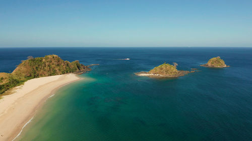 Blue sea and tropical beach, aerial drone. nacpan, el nido, palawan. seascape with tropical beach 