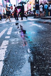 People crossing road in city