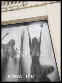 Shadow of people on glass window