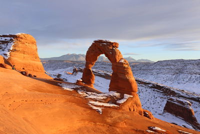 Delicate arch in winter sunset