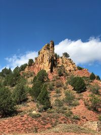 Low angle view of rock formation against sky