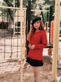 Portrait of young woman standing outdoors