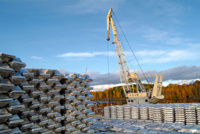 Cranes against sky
