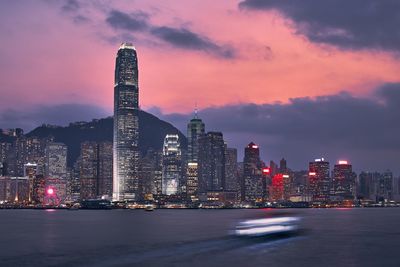 View of illuminated buildings against sky at dusk