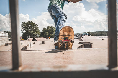 Low section of man against sky