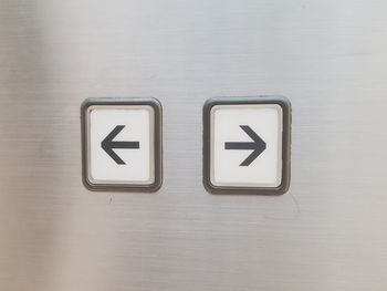 Close-up of information sign on wall