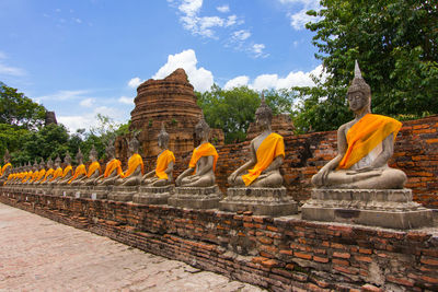 Statue of temple against cloudy sky
