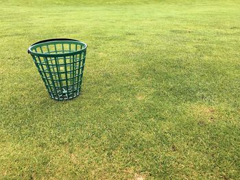 High angle view of wicker basket on field