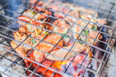 High angle view of meat on barbecue grill