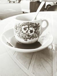 Close-up of coffee cup on table