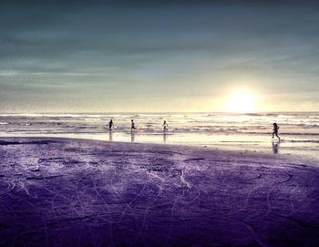 Silhouette of people on beach