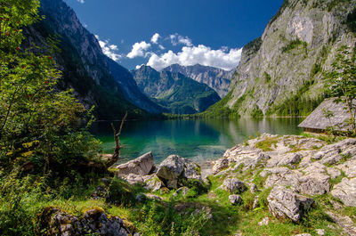 Scenic view of lake and mountains against sky