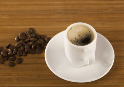 High angle view of coffee cup on table