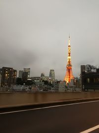 View of illuminated cityscape against sky