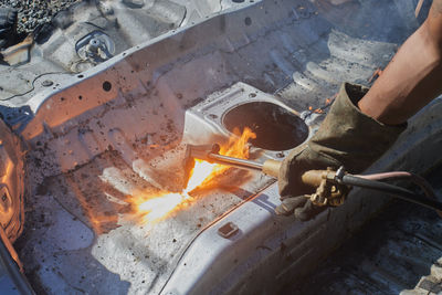 Auto mechanic or car mechanic cut car frame or body by oxygen acetylene cutting technique