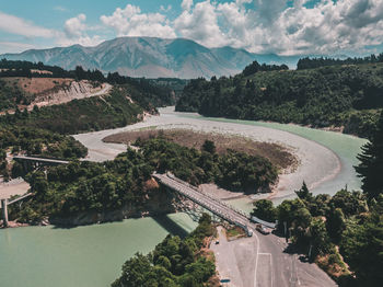 High angle view of road by river against sky