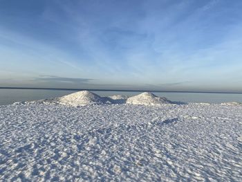 Scenic view of sea against sky during winter