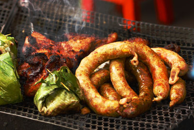 Close-up of meat on barbecue grill