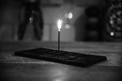 Close-up of candles on table