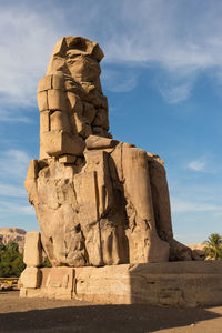 Colossi of memnon luxor thebes against the background of dawn in the egypt