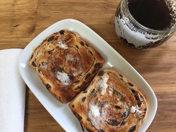 High angle view of butter toast  on  a plate on table,  coffee