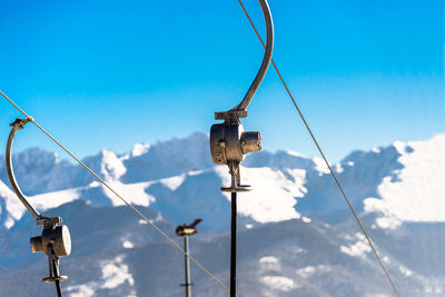 The mechanism of the ski lift, visible metal parts and ropes on which hang chairs in the  tatry