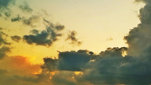 Low angle view of dramatic sky during sunset