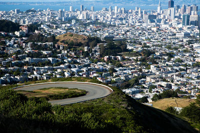 High angle view of road amidst buildings in city