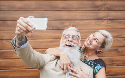 Woman photographing with mobile phone