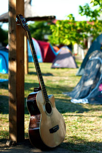 Close-up of guitar in park
