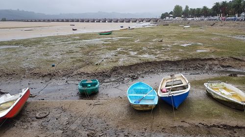Boats moored on shore
