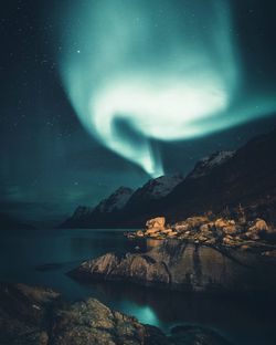 Scenic view of sea against sky at night