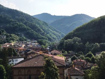 High angle view of houses and mountains against sky