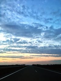Road against sky during sunset