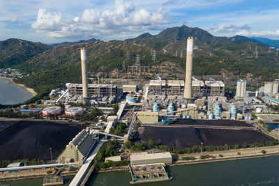 High angle view of buildings and mountains against sky