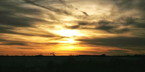 Scenic view of silhouette landscape against sky during sunset