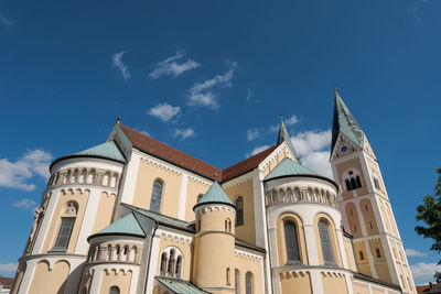 Low angle view of building against blue sky