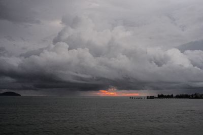 Scenic view of sea against cloudy sky