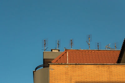 Low angle view of building against blue sky