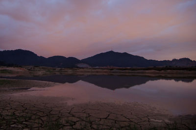 Scenic view of lake against sky during sunset