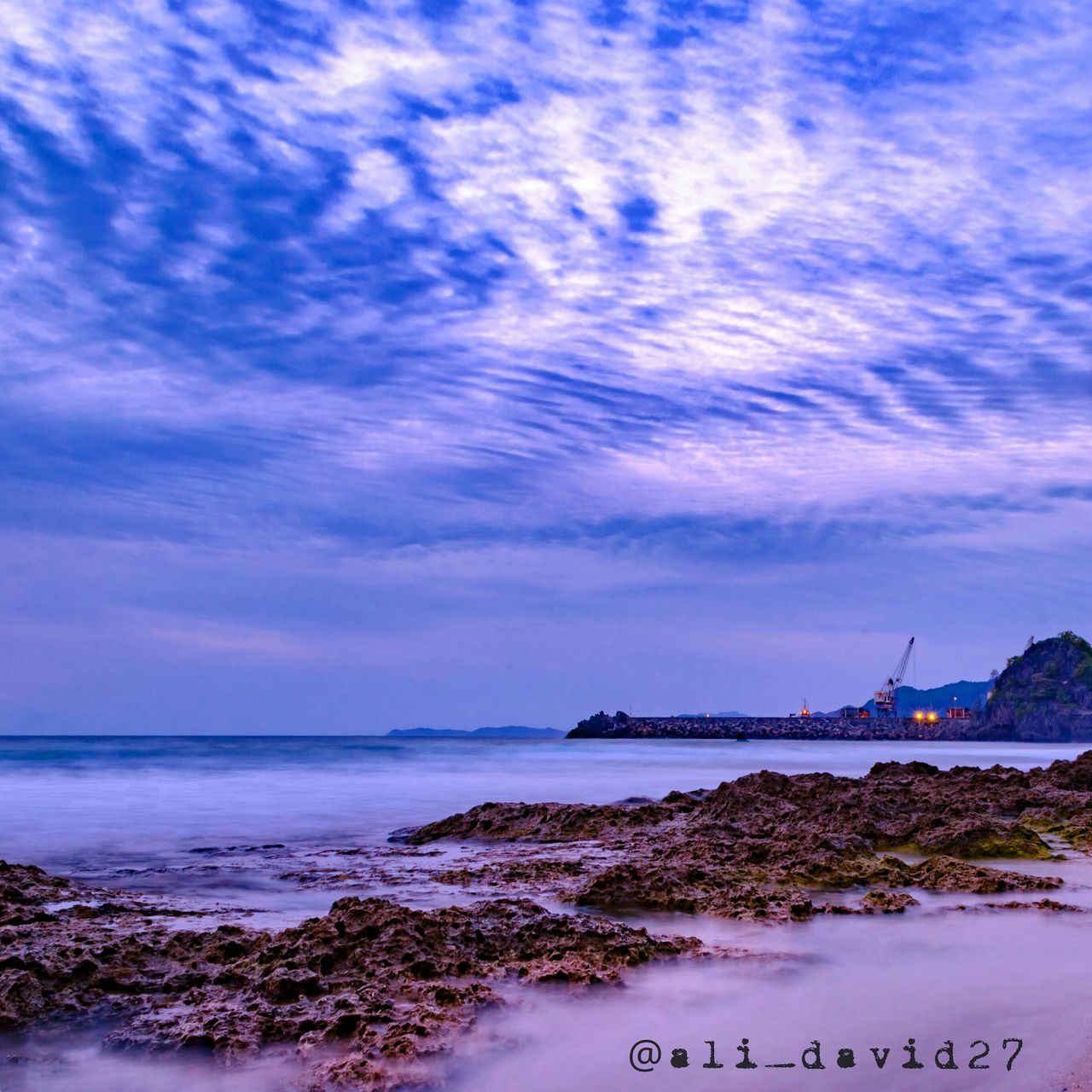 VIEW OF SEA AGAINST CLOUDY SKY