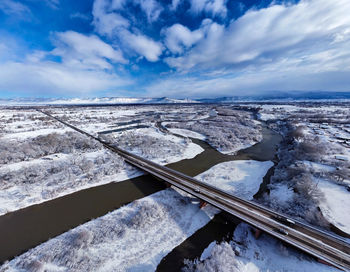 Light snow over colorado river in grand junction, colorado