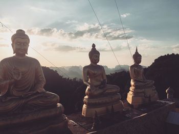 Statue of buddha against sky