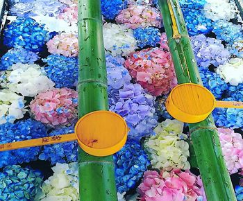 High angle view of multi colored umbrellas on street market