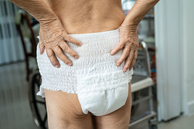 Midsection of man wearing diaper