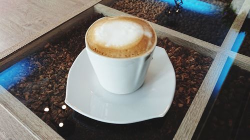 High angle view of coffee cup on table