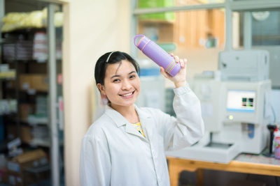 Confident nurse working at laboratory